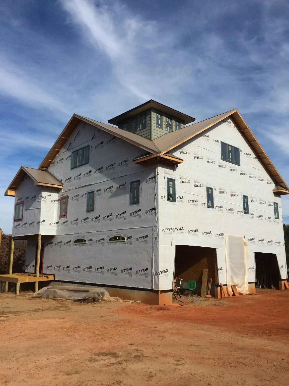 New two story house under construction with a cupola and gabled roofs in Bowen